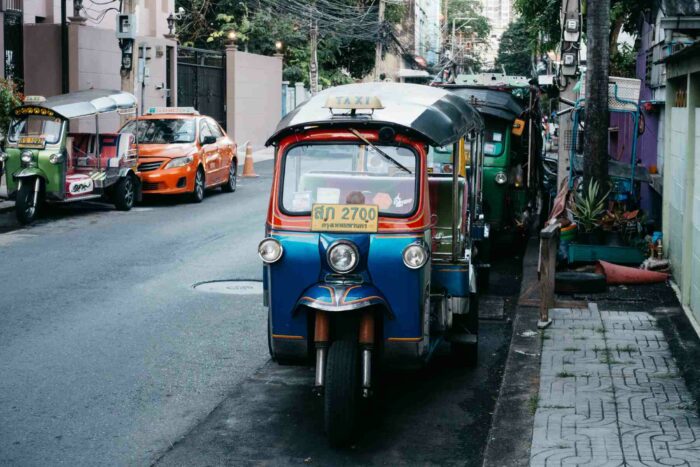riding a tuk tuk is a must try when you travel